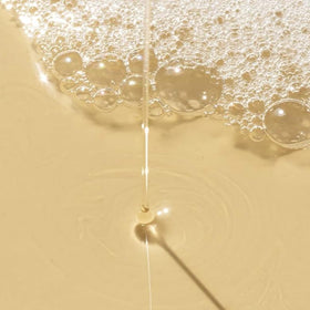 REVERIE pump close-up with texture showing easy dispensing benefit
