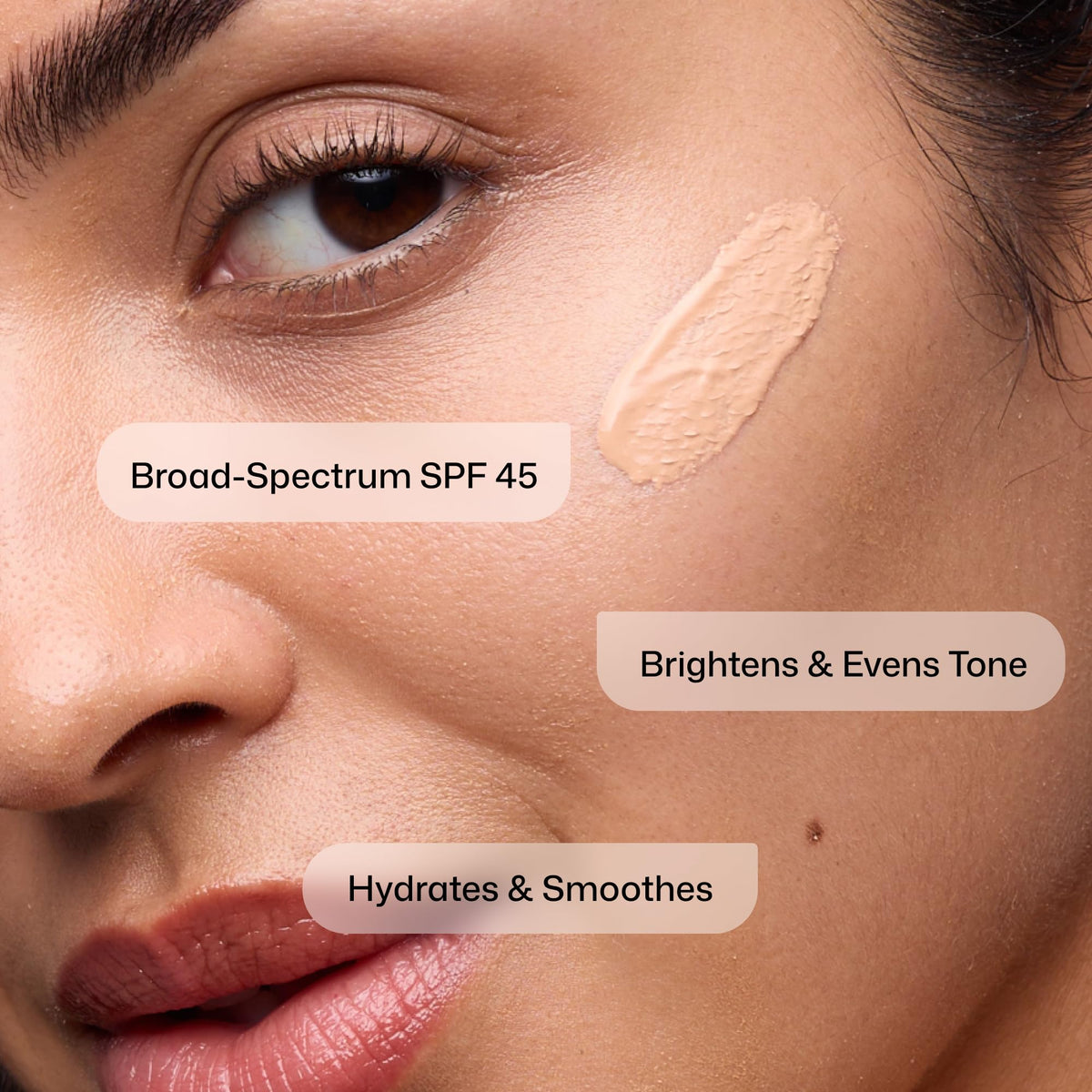 Revision Skincare tint swatch on hand showing sheer coverage and tone-blurring