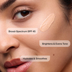 Revision Skincare tint swatch on hand showing sheer coverage and tone-blurring