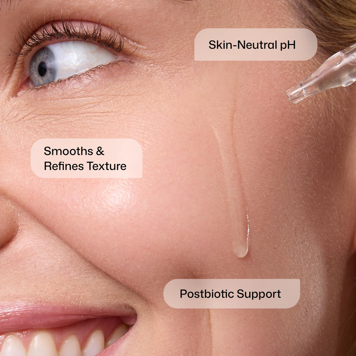 Revision Skincare label close-up listing acids and postbiotic support for clarity
