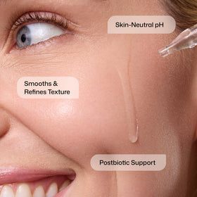 Revision Skincare label close-up listing acids and postbiotic support for clarity