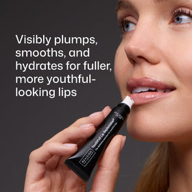 Revision Skincare ceramic applicator close-up for soothing, precise application