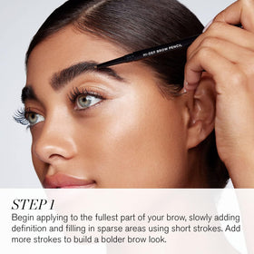 RevitaLash spoolie brush blending color and taming brow hairs effectively