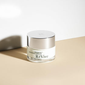 RéVive moisturizer being applied to hand illustrating calming hydration