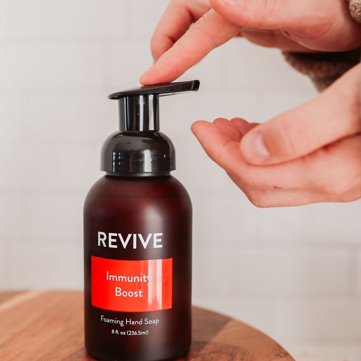 REVIVEEO soap in use at a kitchen sink demonstrating gentle cleanse
