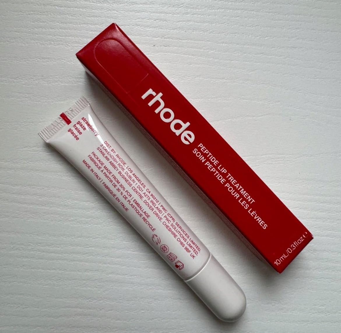 Rhode closeup texture swatch showing smooth peptide gloss and hydrated effect