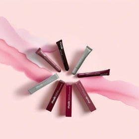 Rhode gloss lip tint swatch on arm demonstrating buildable toast color