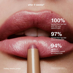 Rhode lip shaper scale hand comparison showing product size and travel-friendly benefit