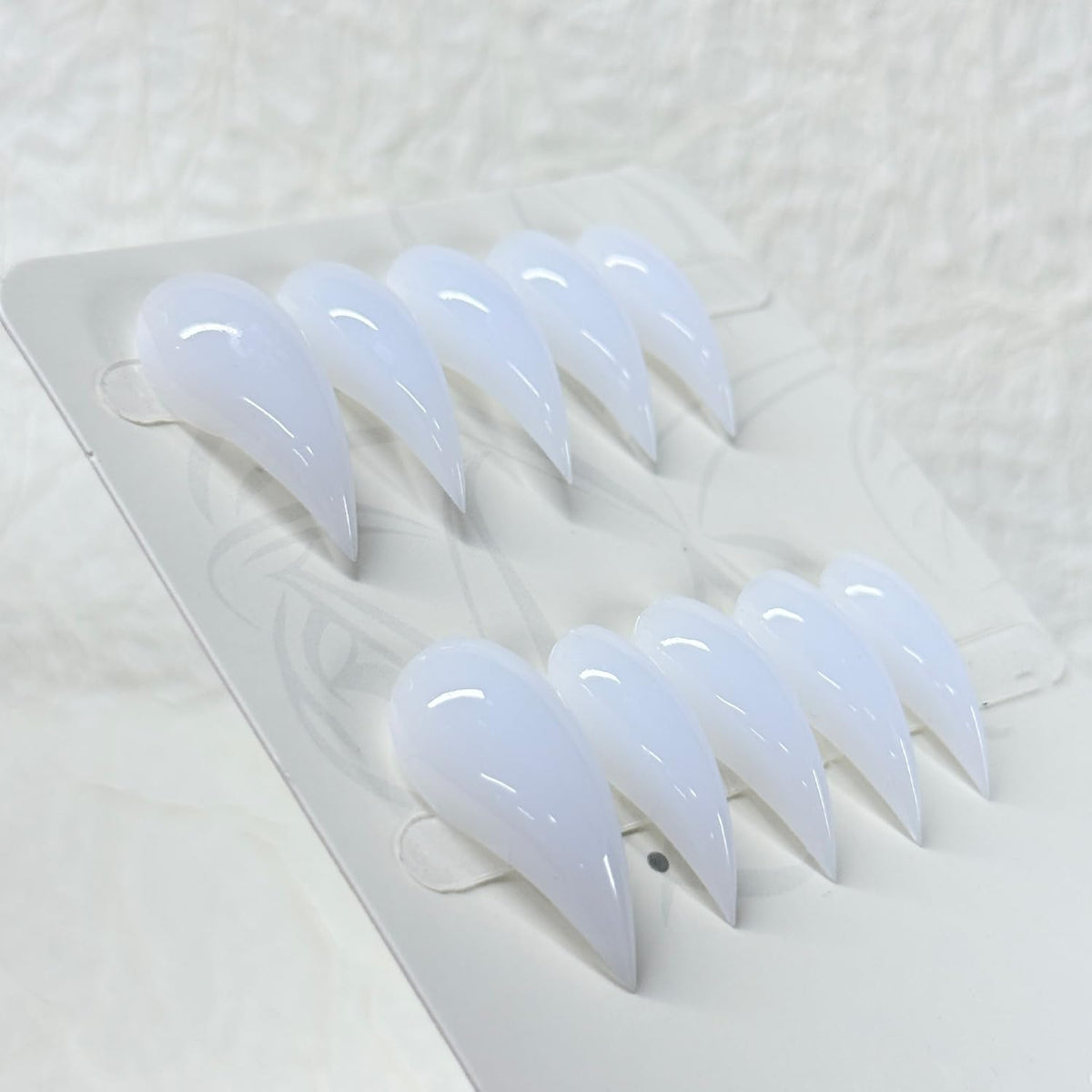 RIICFDD comparison with ruler showing compact stiletto length for everyday wear