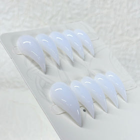 RIICFDD comparison with ruler showing compact stiletto length for everyday wear