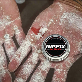 RipFix tin held in hand to show scale and portable 1.34 oz size for athletes