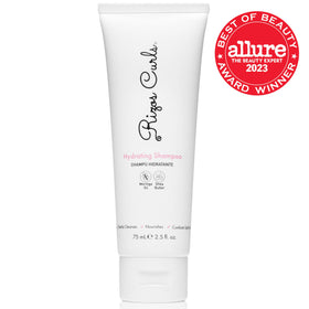 Rizos Curls travel bundle in hand showing compact size for convenient travel