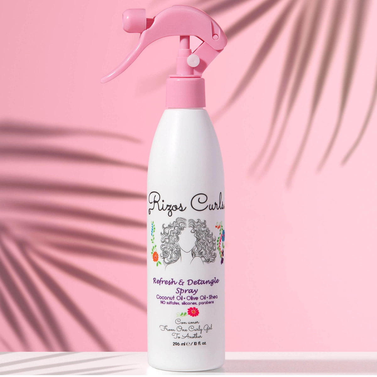 Rizos Curls texture on fingers highlighting nourishment and non-greasy finish