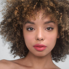 RMS Beauty application on lips showing glossy finish and hydrating look