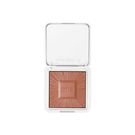 RMS Beauty compact front view showing sleek refillable bronzer for portable glow