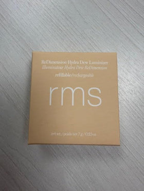 RMS Beauty luminizer inside a makeup bag showing travel-ready everyday convenience