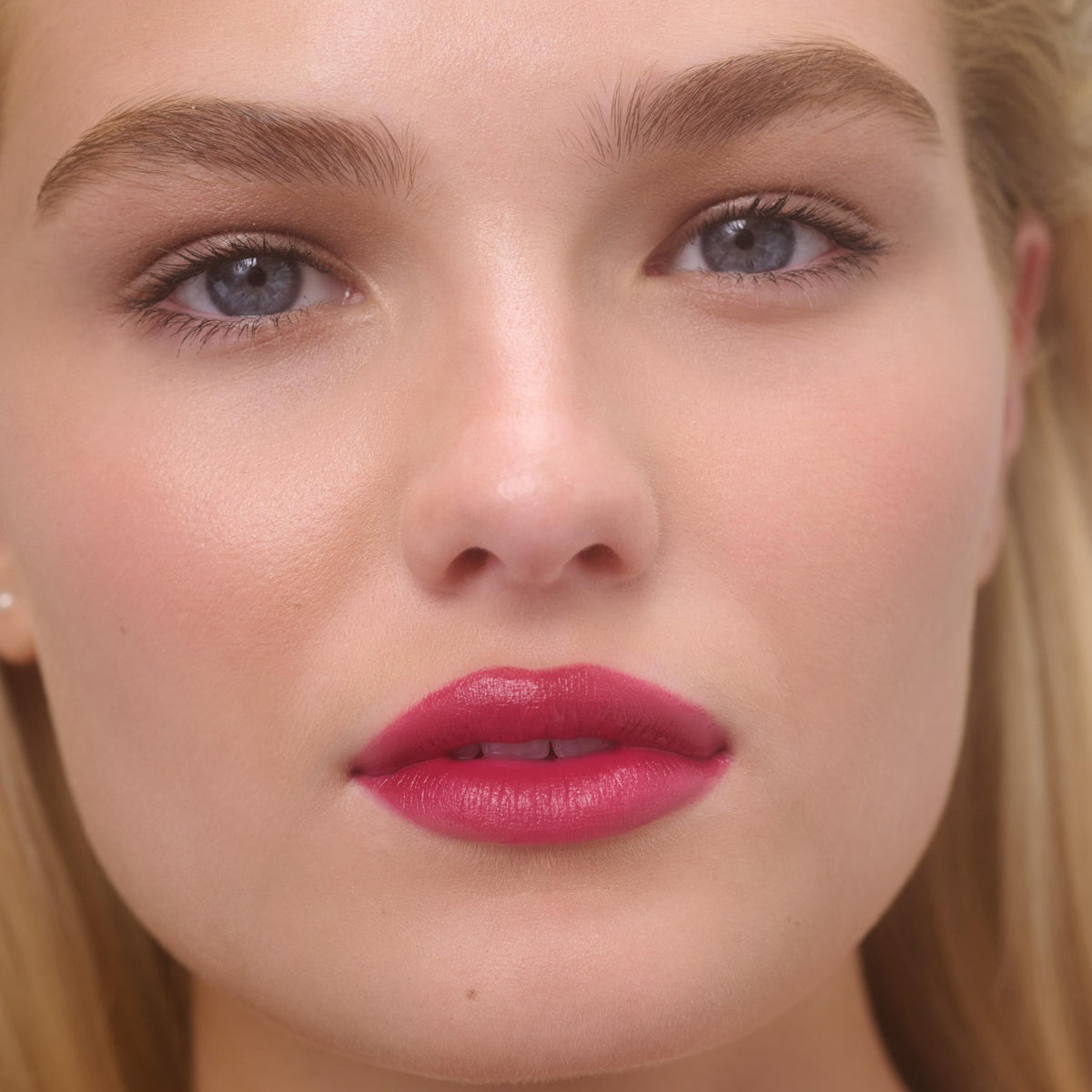 RMS Beauty applied on lips in daylight showing natural dewy color benefit
