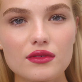 RMS Beauty applied on lips in daylight showing natural dewy color benefit