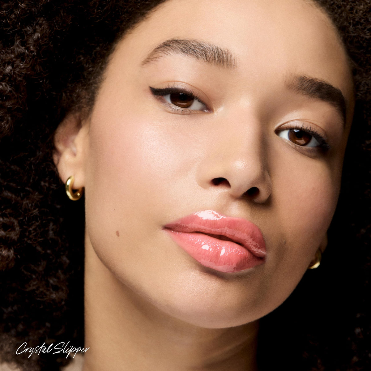RMS Beauty texture swipe showing high-shine reflective gloss benefit
