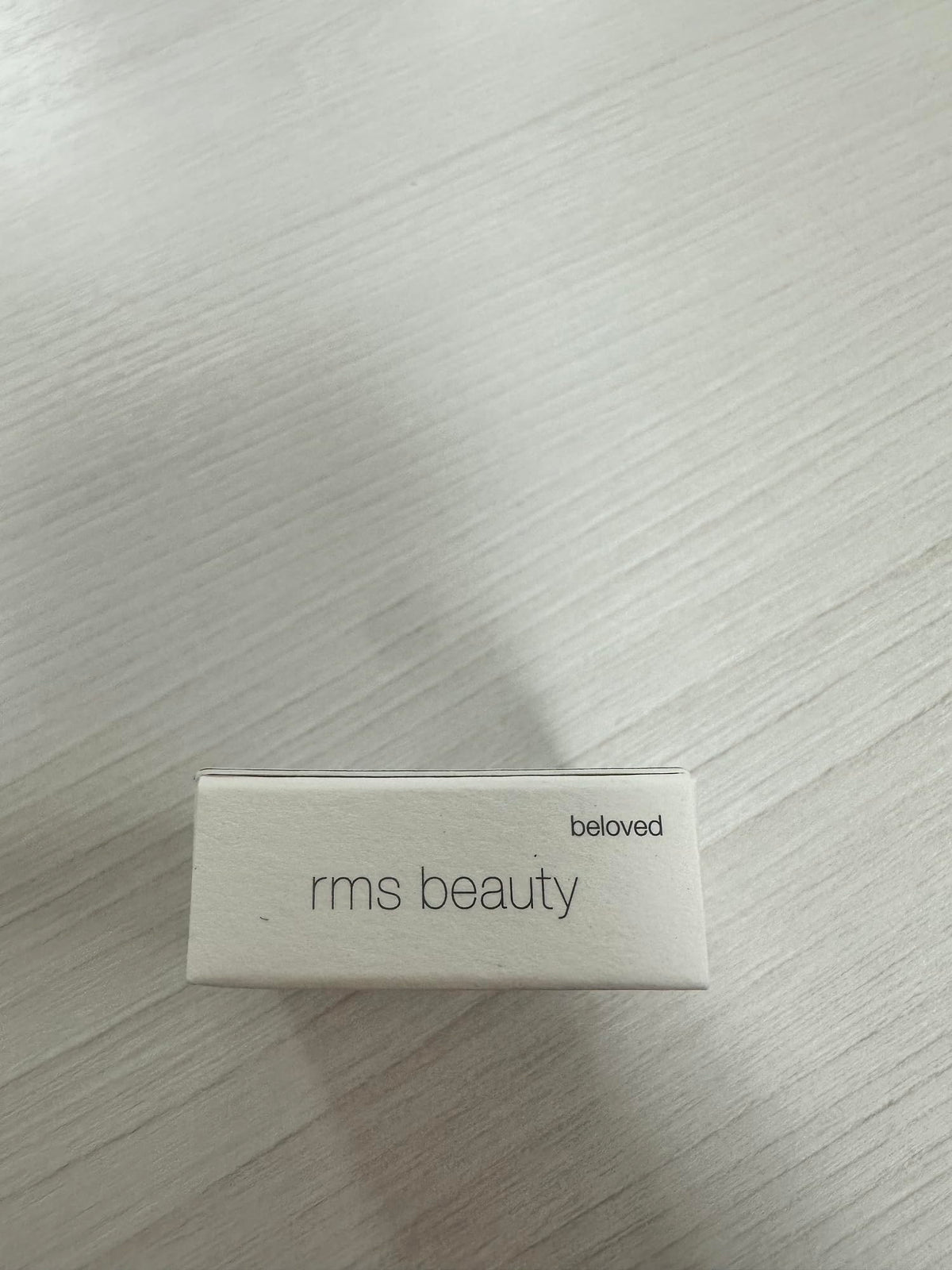RMS Beauty compact inside purse illustrating travel-friendly multitask color touch-ups