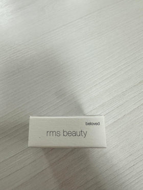 RMS Beauty compact inside purse illustrating travel-friendly multitask color touch-ups