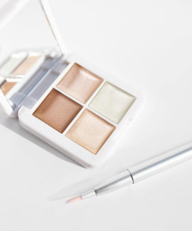 RMS Beauty pot next to coin showing compact size and easy portability