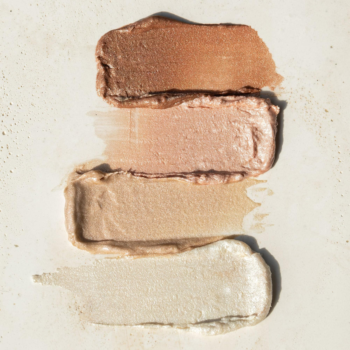 RMS Beauty luminizer inside makeup bag styled for everyday use