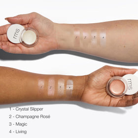 RMS Beauty luminizer blended on cheekbone delivering a subtle natural highlight
