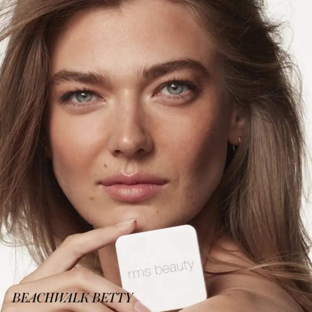 RMS Beauty held in hand to show size and easy touch-up convenience