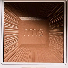 RMS Beauty side profile of compact emphasizing sleek, portable packaging