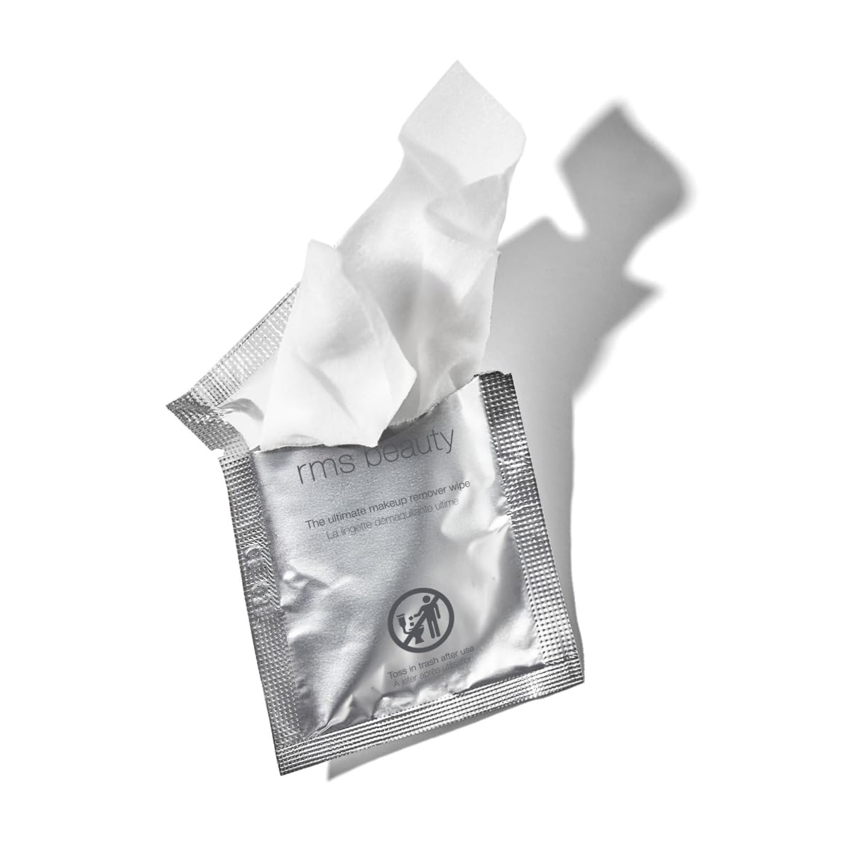 RMS Beauty wipes beside travel kit illustrating compact size and portability