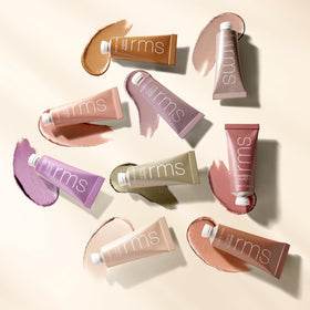 RMS Beauty Eyelights size comparison next to coin showing compact travel-friendly size