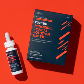 Ro dropper close-up applying solution to scalp for targeted treatment