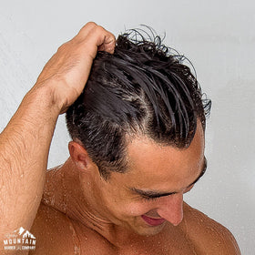 Rocky Mountain Barber Company man using conditioner conveying effortless grooming