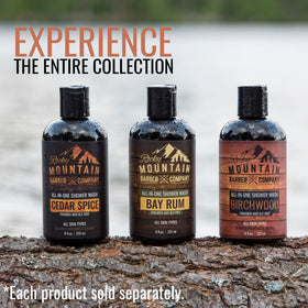 Rocky Mountain Barber Company lifestyle barbershop scene conveying classic bay rum scent appeal