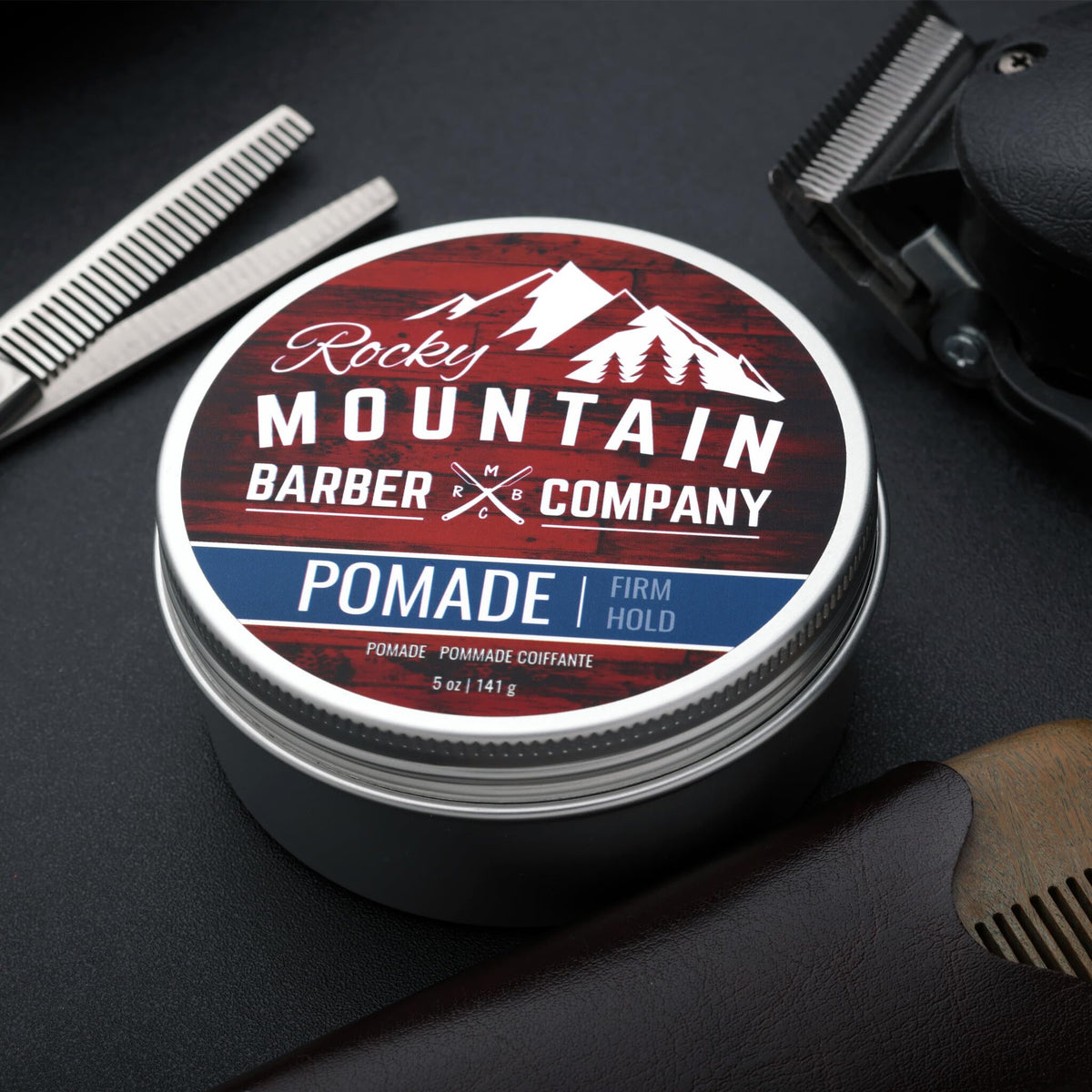 Rocky Mountain Barber Company 5 oz tin beside smaller jars to show value and size