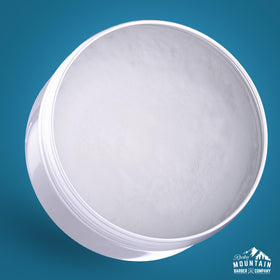 Rocky Mountain Barber Company open tin of pomade showing product quantity advantage