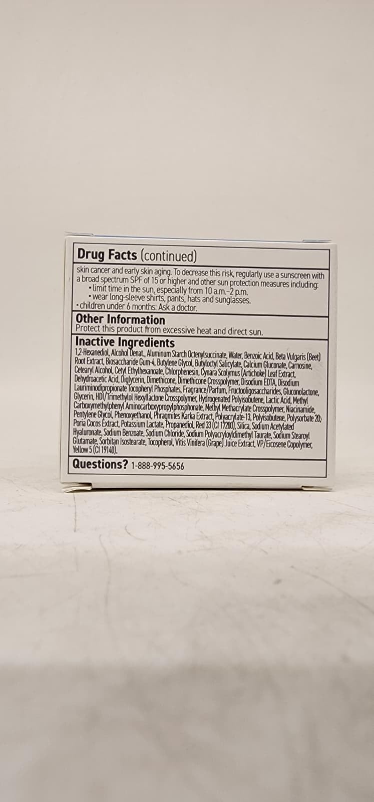 RODAN + FIELDS tube beside makeup indicating makeup-friendly SPF benefit