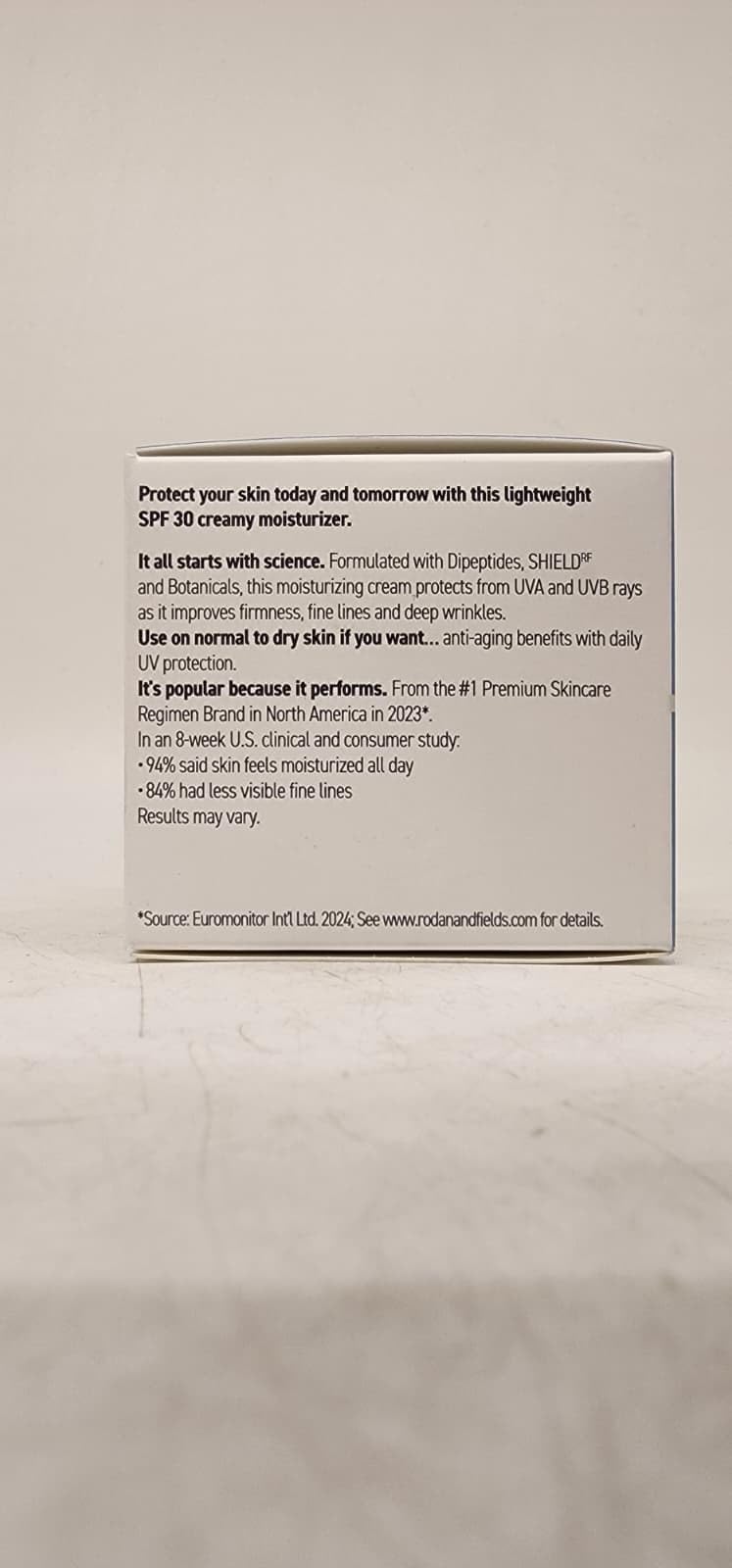 RODAN + FIELDS on bathroom shelf lifestyle scene conveying daily-use benefit