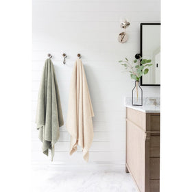 ROLSHOL towel on bathroom vanity in lifestyle scene showing travel convenience