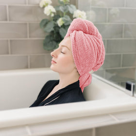 ROLSHOL towel next to hand showing large 27.5x39.4 inch size and full coverage