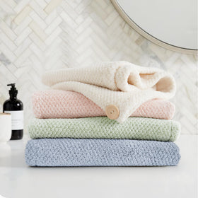 ROLSHOL towel in a gym bag and suitcase showing portability and quick-dry benefit
