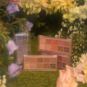 rom&nd close-up of shadow pans highlighting matte texture and glitter particles