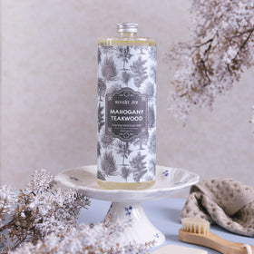 ROMIIE ZOI bottle on bathroom vanity suggesting a soothing, decorative benefit
