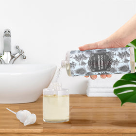 ROMIIE ZOI bottle by kitchen sink showing effective grease-cleansing benefit