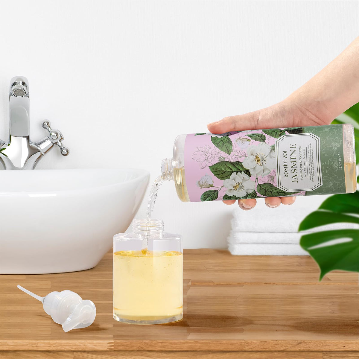 ROMIIE ZOI pouring refill into dispenser showing easy refill and spill reduction
