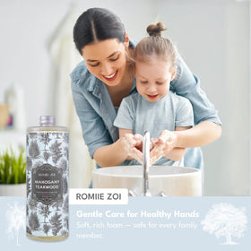 ROMIIE ZOI bottle next to a hand for scale demonstrating generous refill size benefit