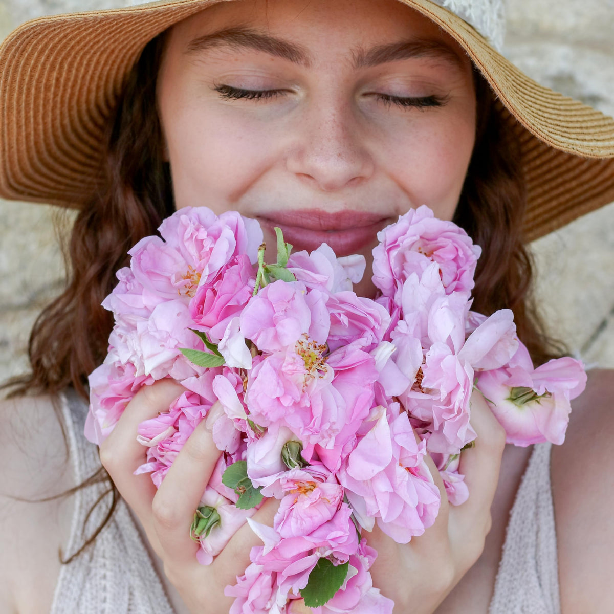 Rosense mist spraying on face demonstrating gentle hydration and midday refresh