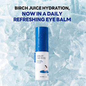 ROUND LAB applying stick to under-eye area for instant refresh