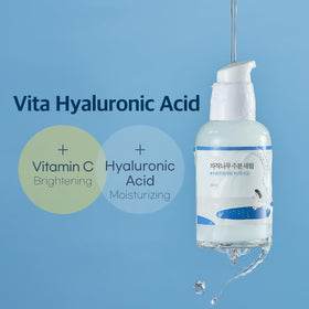 ROUND LAB 50ml bottle next to common items to show compact travel-friendly size
